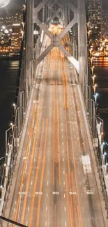 Orange light trails on Golden Gate bridge at night.