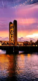 Golden bridge under sunset with rain and reflections.