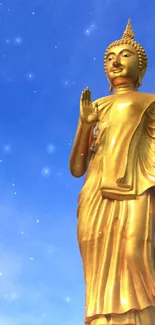 Golden Buddha statue set against a bright blue sky on mobile wallpaper.