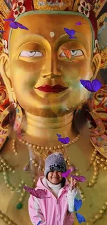 Golden Buddha statue with butterflies, perfect for a serene wallpaper.