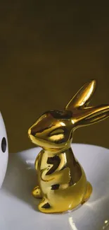 Stylish gold bunny and white egg design wallpaper.