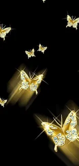 Elegant wallpaper featuring golden butterflies on a dark background.