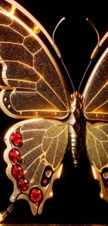 Golden butterfly with glowing accents on black background wallpaper.