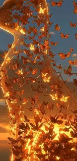 Golden cat silhouette formed by butterflies at sunset.
