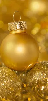 Golden Christmas ornament with sparkling festive background.