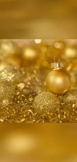 Golden Christmas ornaments with festive sparkle background.