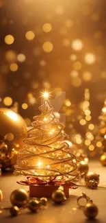 Golden Christmas tree with ornaments and twinkling lights, perfect festive wallpaper.