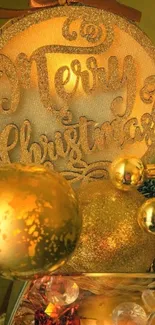 Golden 'Merry Christmas' ornaments with festive decorations.