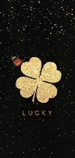Golden clover wallpaper with butterfly and 'Lucky' text on black background.