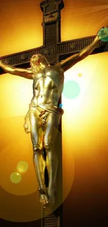 Golden cross with Jesus on glowing background.