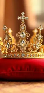 Ornate golden crown on red velvet cushion