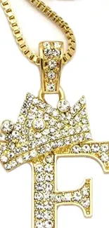 Golden pendant with a crown design, encrusted with diamonds.