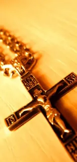 Close-up of a golden crucifix on a chain.