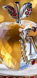 Golden crystal apple art with intricate design.
