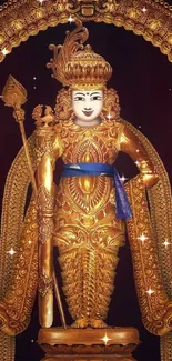 Golden deity statue with ornate arch on a dark background.