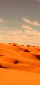 Golden desert dunes under a serene blue sky.