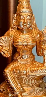 Golden divine statue with intricate design, perfect for mobile wallpaper.