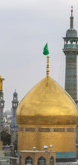 Stunning golden dome with minarets set against a city skyline, perfect for mobile wallpaper.