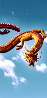 Golden dragon flying in a clear blue sky with fluffy clouds.