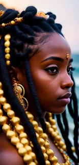 Woman with golden accessories by the ocean, showcasing elegance.