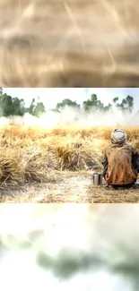 Serene golden field with lone figure, mobile wallpaper.