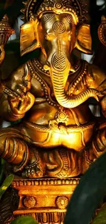 Golden Ganesha statue as mobile wallpaper.