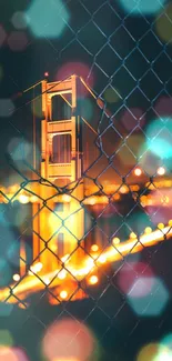 Golden Gate Bridge at night framed by a wire fence, glowing in orange hues.