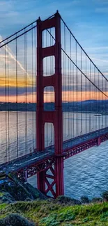 Golden Gate Bridge wallpaper at sunset over the ocean.