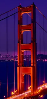 Golden Gate Bridge glowing at twilight with city lights.