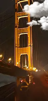 Night view of Golden Gate Bridge with clouds.