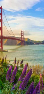 Golden Gate Bridge with colorful flowers and ocean view.