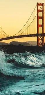 Golden Gate Bridge at sunset with ocean waves.