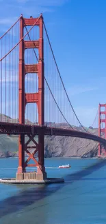 Golden Gate Bridge with blue sky and bay.