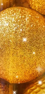 Shimmering golden ball with glitter sparkles.