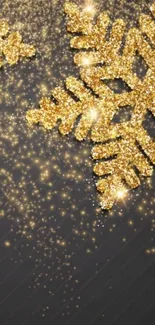 Golden glitter snowflake on dark background, perfect for festive decor.