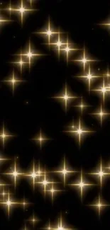 Golden glitter stars sparkling on a dark background wallpaper.