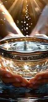 Hands holding a glowing golden bowl with sparkling light.