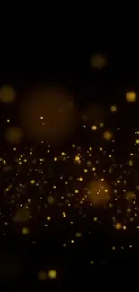 Golden glow particles on a dark background wallpaper.