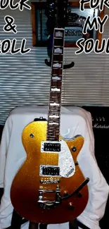 Golden electric guitar with 'Rock & Roll For My Soul' text on a wallpaper.