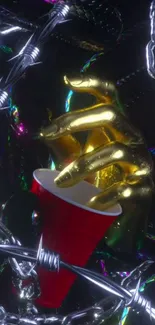 Gold hand holding a red cup with metallic chains on a dark background.