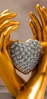 Golden hands holding a heart-shaped ornament.