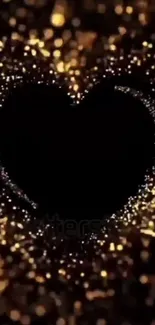 Heart-shaped design with golden sparkles on a dark background.