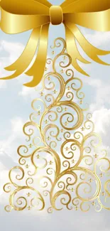 Golden Christmas tree with bow on cloudy sky background.