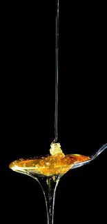 Golden honey drips from a spoon against a dark background.