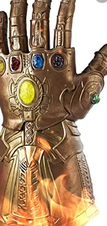 Golden Infinity Gauntlet with colorful stones on a mobile wallpaper.