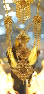 Intricate golden jewelry design with sparkling details against a soft focus backdrop.