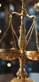 Ornate gold scales of justice with vintage design.