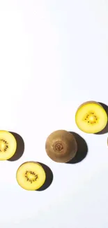 Minimalist wallpaper with sliced golden kiwis on white background.