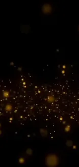 Golden light particles sparkling on a black background, ideal for phone wallpaper.