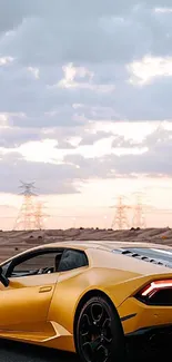 Golden sports car against a desert backdrop with dramatic evening sky.